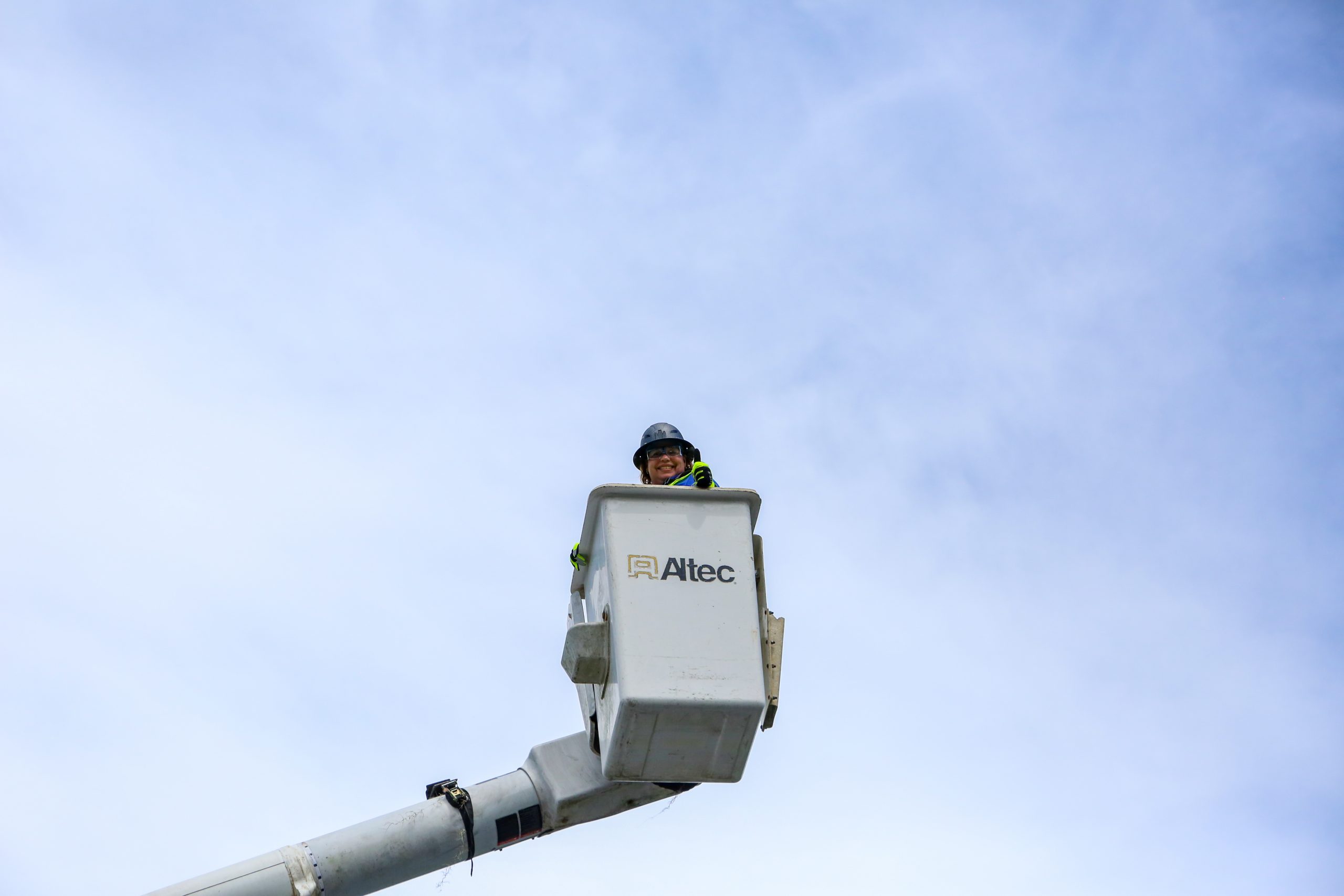 Cindy Mercado in a bucket truck.