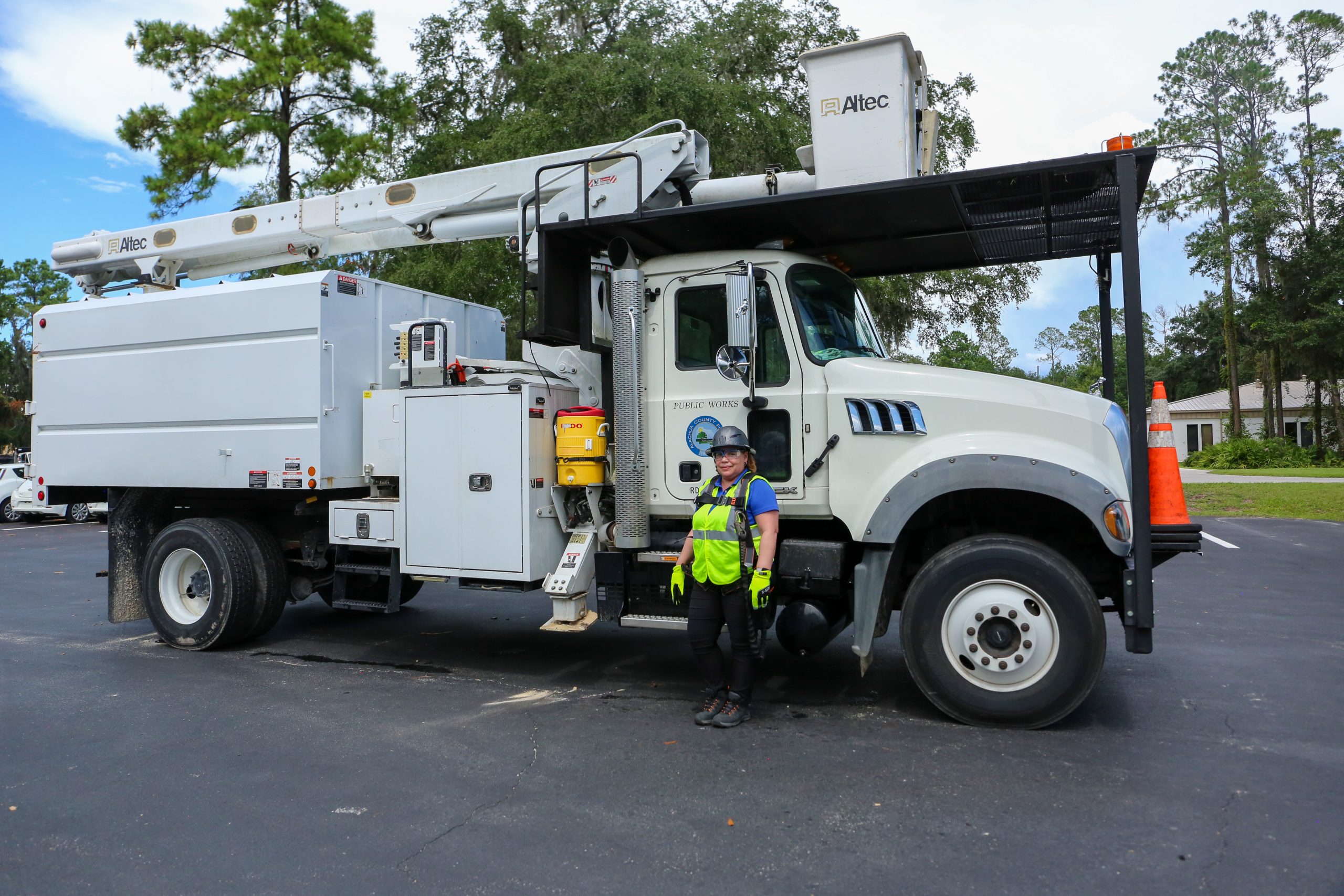 Cindy Mercado standing in front of a bucket truck.